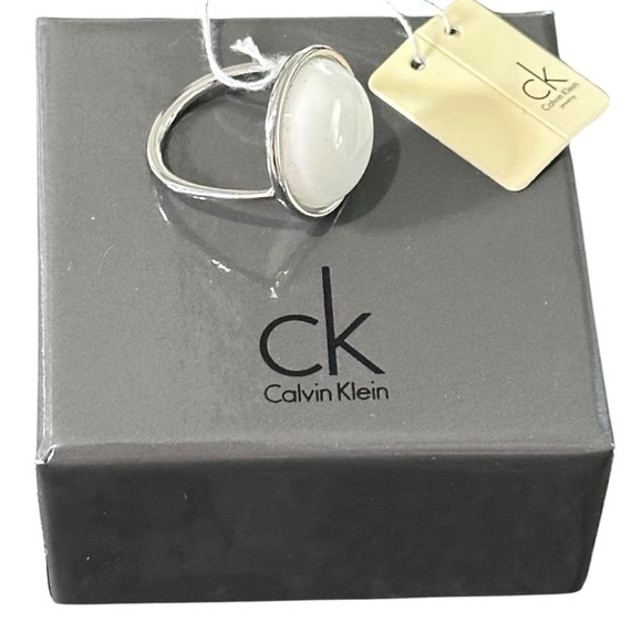 Calvin Klein NWT Loop Two Tone Ring with a Round White Coral Stone Size 9 - Picture 6 of 8